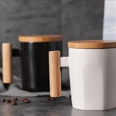 Ceramic coffee cup with wooden handle