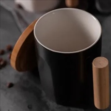 Ceramic coffee cup with wooden handle